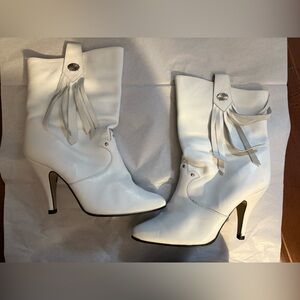 Western style vintage heeled boots with fringe